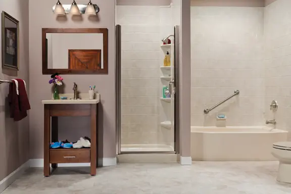 Biscuit tub with travertine tile shower and vanity