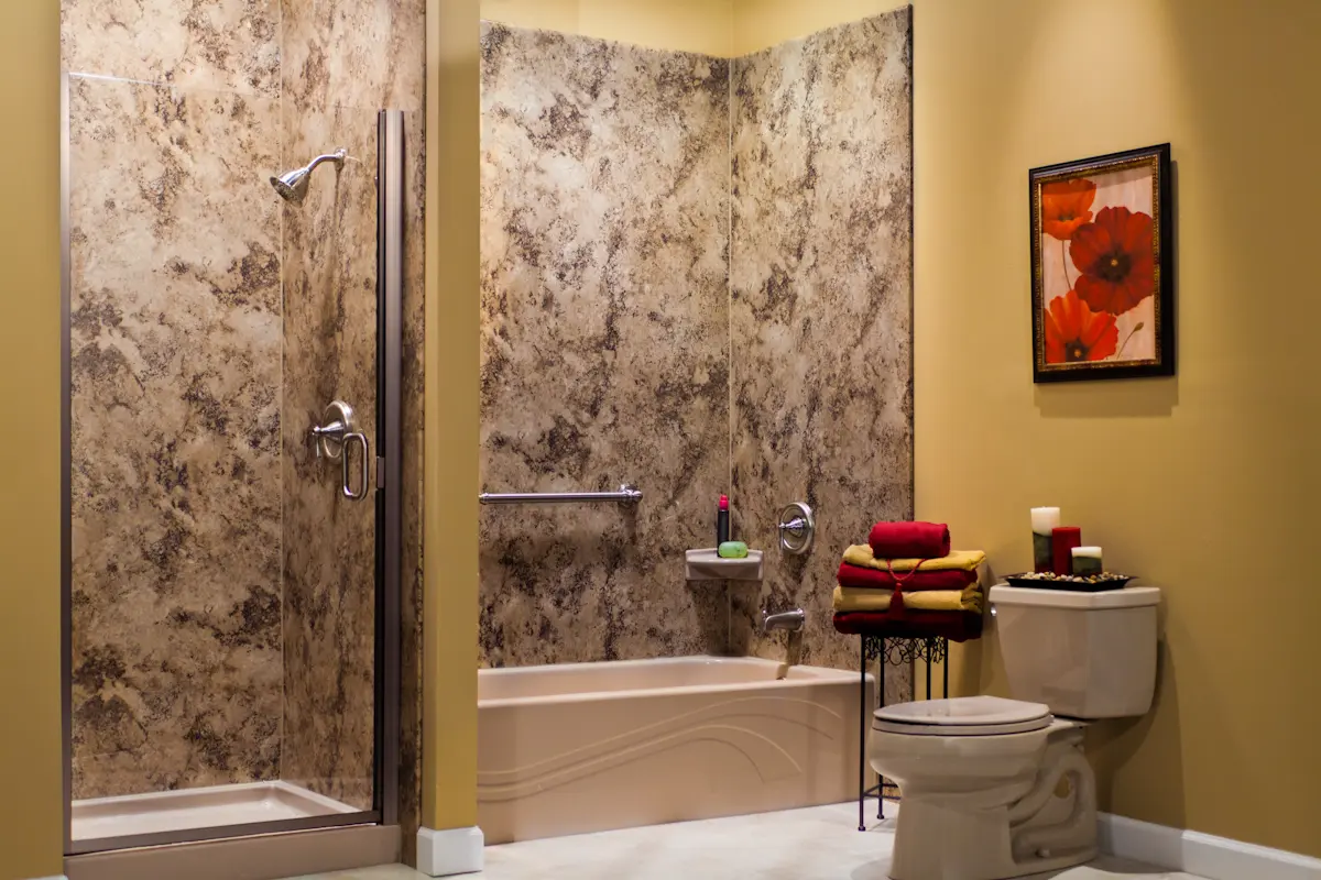Sandbar wave tub and shower with Madeira granite walls and brushed nickel