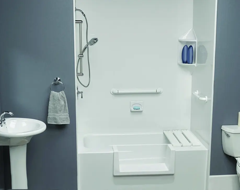 Walk-thru tub cutout with grab bars, handheld shower, and fold-down seat
